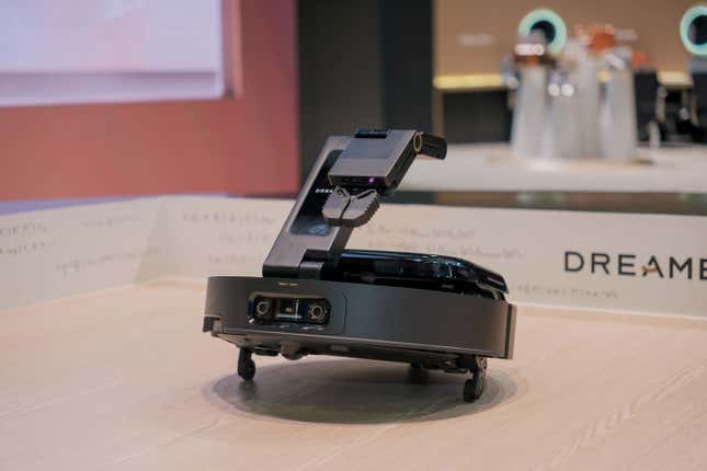 Dreame Technology's ultra robot vacuum shown tilted up on its "legs"